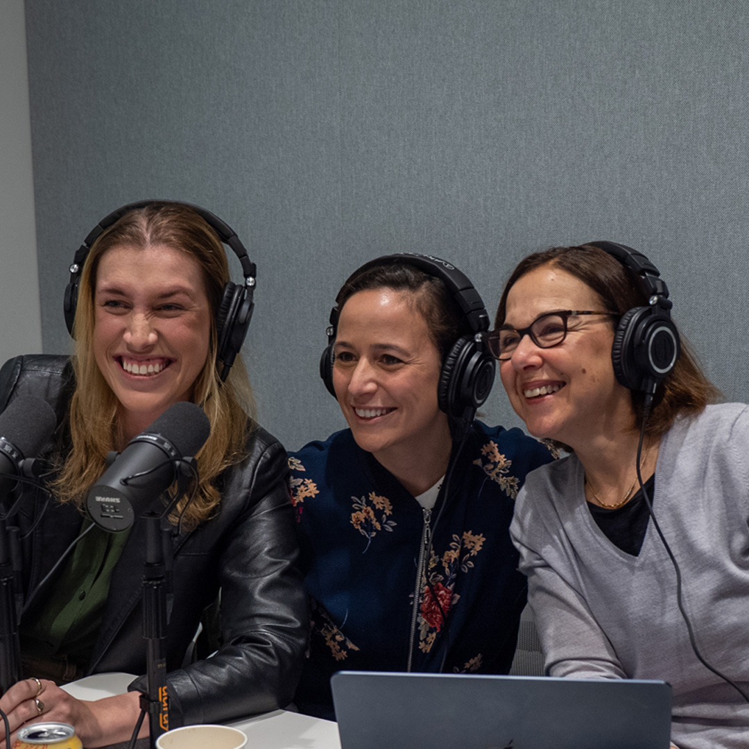 Hil Moss, Natasha Steele and Lidia Schapira smiling for a photo in the recording studio.